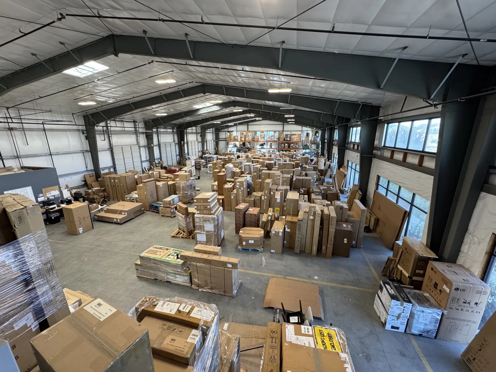 ASAP Movers logistics warehouse with boxed goods ready for distribution