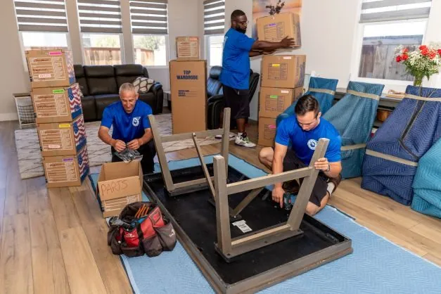 ASAP Movers crew preparing furniture inside a moving truck