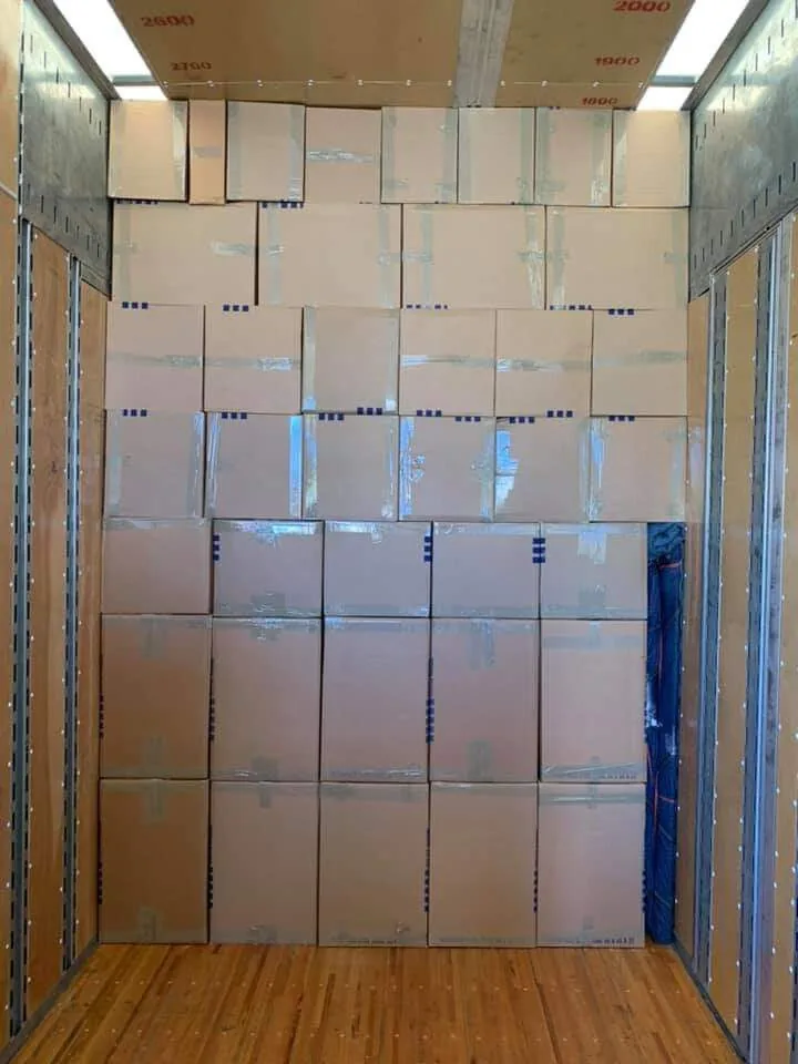 Moving boxes stacked inside an ASAP Movers truck